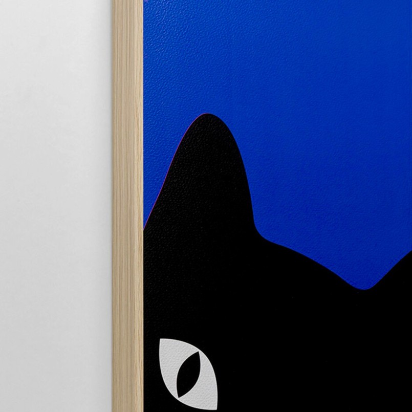 Black paintings of playful cats on a blue background - Kare Design